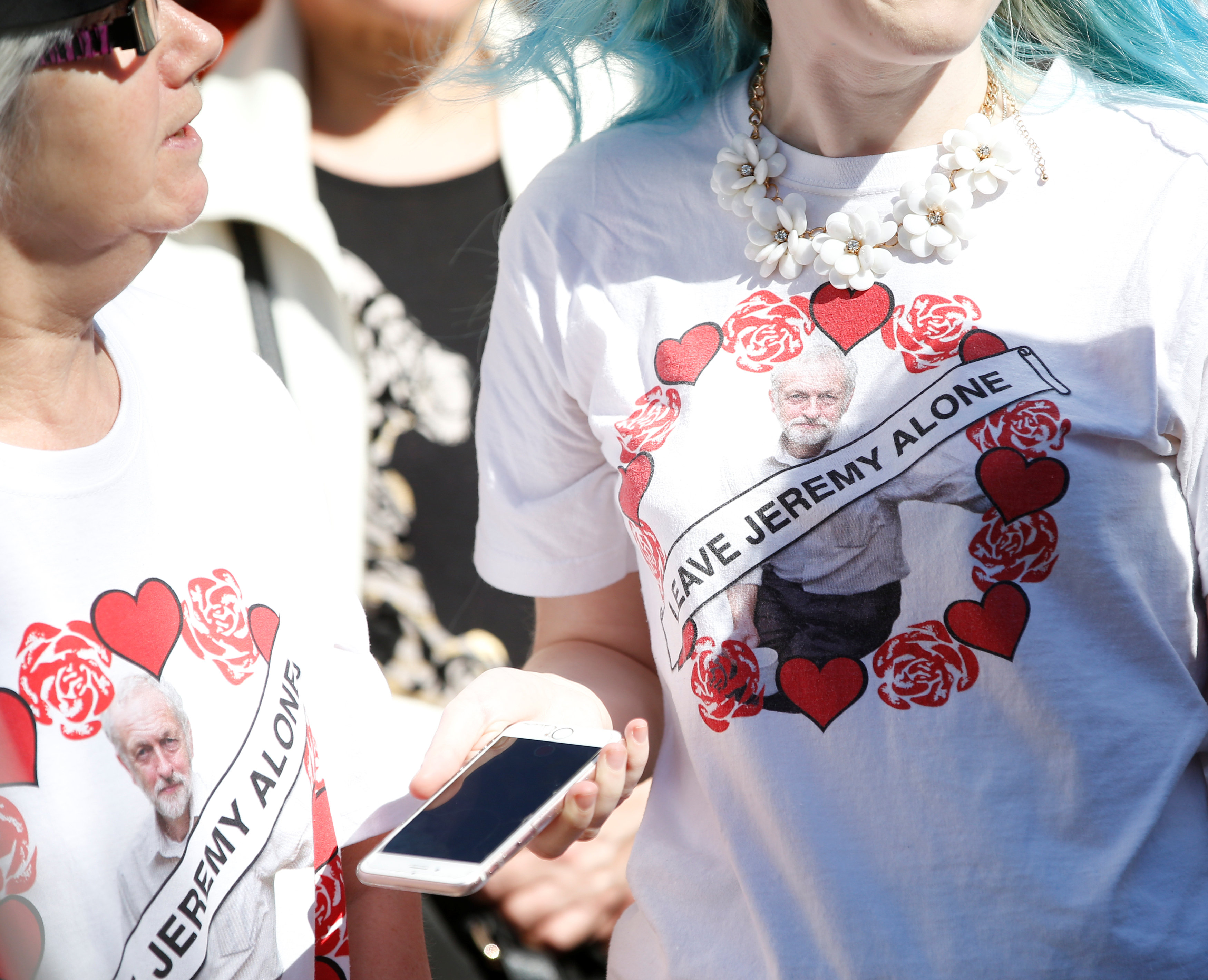 Women wear Jeremy Corbyn t-shirts as Jeremy Corbyn, the leader of Britain's opposition Labour Party, arrives to speak to the public during an election campaign visit in the centre of Crewe April 22, 2017. REUTERS/Andrew Yates