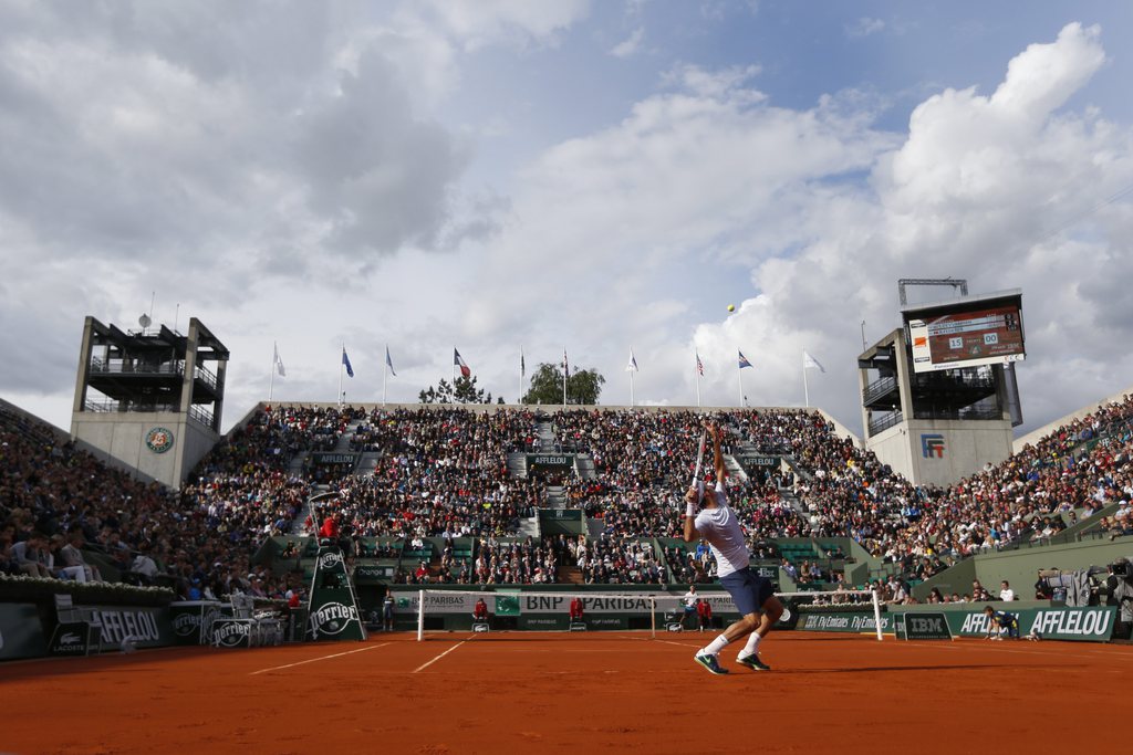 Switzerland's Roger Federer serves against India's Somdev Devvarman in their second round match of the French Open tennis tournament, at Roland Garros stadium in Paris, Wednesday, May 29, 2013. Federer won in three sets 6-2, 6-1, 6-1. (AP Photo/Petr David Josek)