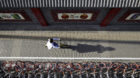 A woman rides an Ofo's shared bike past Mobike's shared bikes in Beijing's central business area, China April 21, 2017. Pictu