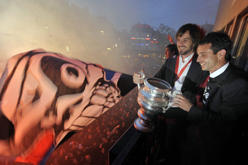 FC Basel's goalkeeper and captain Franco Costanzo, left, and vicepresident Bernhard Heusler, right, celebrate in the city center of Basel after winning the Swiss Cup final soccer match between FC Basel and FC Lausanne-Sport at the St. Jakob-Park Stadium in Basel, Switzerland, Sunday, May 9, 2010. (KEYSTONE/Georgios Kefalas)