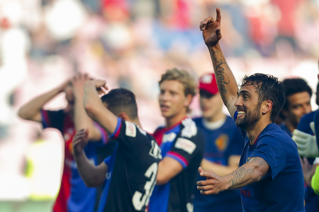 Basel's midfielder Matias Delgado of Argentina, right, celebrates his team's victory after the Swiss Cup final soccer match between FC Basel 1893 and FC Sion at the stade de Geneve stadium, in Geneva, Switzerland, Thursday, May 25, 2017. (KEYSTONE/Valentin Flauraud)