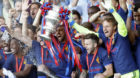 Basel's players midfielder Matias Delgado of Argentina, and goalkeeper Tomas Vaclik of Czech Republic, lift the trophy after 