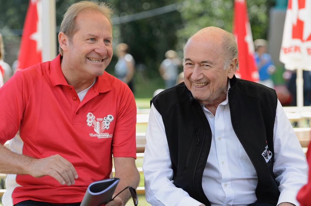 FIFA President, Swiss Joseph Sepp Blatter, right, speaks with former Swiss soccer player Jean-Paul Brigger, left, during the 18th edition of the