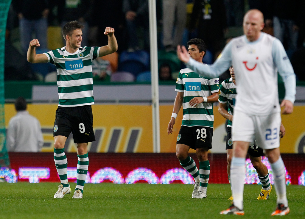 Sporting's Ricky van Wolfswinkel, from the Netherlands, left, celebrates after scoring the opening goal against Zurich during their Europa League group D, soccer match Thursday, Dec. 1 2011, at Sporting's Alvalade stadium. (AP Photo/Armando Franca)
