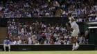 Switzerland's Roger Federer returns to Ukraine's Alexandr Dolgopolov during their Men's Singles Match on day two at the Wimbl