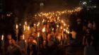 White nationalists carry torches on the grounds of the University of Virginia, on the eve of a planned Unite The Right rally 