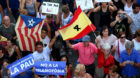 People hold signs and flags during a march of unity after the attacks last week, in Barcelona, Spain, August 26, 2017. REUTER