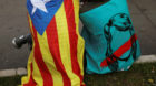 People take a break during a protest outside the High Court of Justice of Catalonia in Barcelona, Spain, September 21, 2017. 