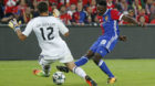 Basel's Dimitri Oberlin, right, scores to 2:0 against Benfica's goalkeeper Julio Cesar, left, during an UEFA Champions League