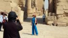 (170917) -- LUXOR (EGYPT), Sept. 17, 2017 -- A Chinese tourist poses for a photo during her visit to the Karnak Temple in Lux