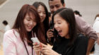 People look at iPhone X during its launch at the Apple store in Singapore November 3, 2017. REUTERS/Edgar Su