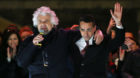5-Star Movement founder Beppe Grillo (L) speaks next leader Luigi Di Maio during the finally rally ahead of the March 4 elect