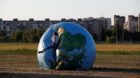 A woman jumps on an inflatable globe outside the stadium in Kaliningrad, Russia, June 28, 2018. As well as shooting all the m