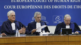 Judges of the European Court of Human Rights sit in the courtroom at the start of an hearing concerning the case of Vincent L