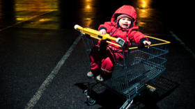 Little girl forgotten at the parking lot of a Shopping mall.http://www.phototrolley.com/downloads/BannersIstock/BannerBizarre